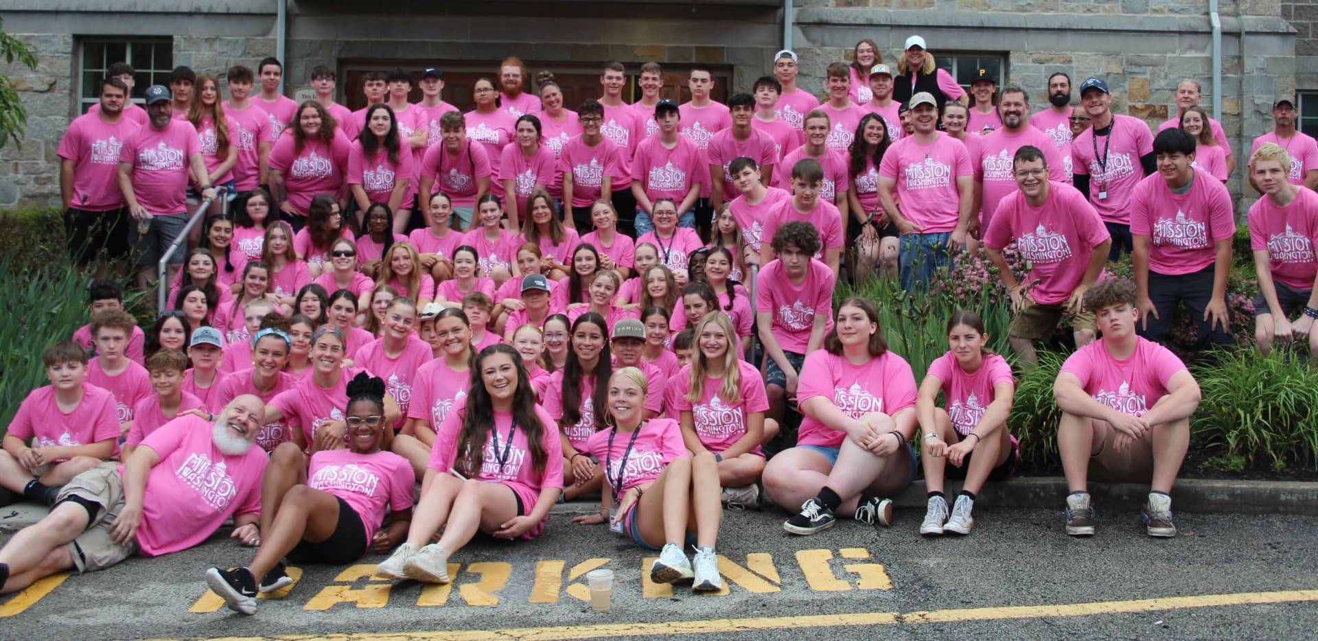 Large group wearing pink custom printed event t-shirts by Hardiewear