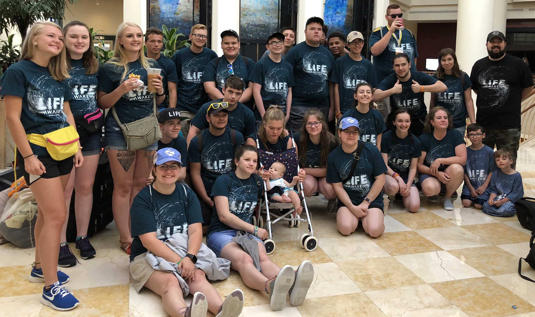 Youth group wearing navy custom printed event shirts by Hardiewear