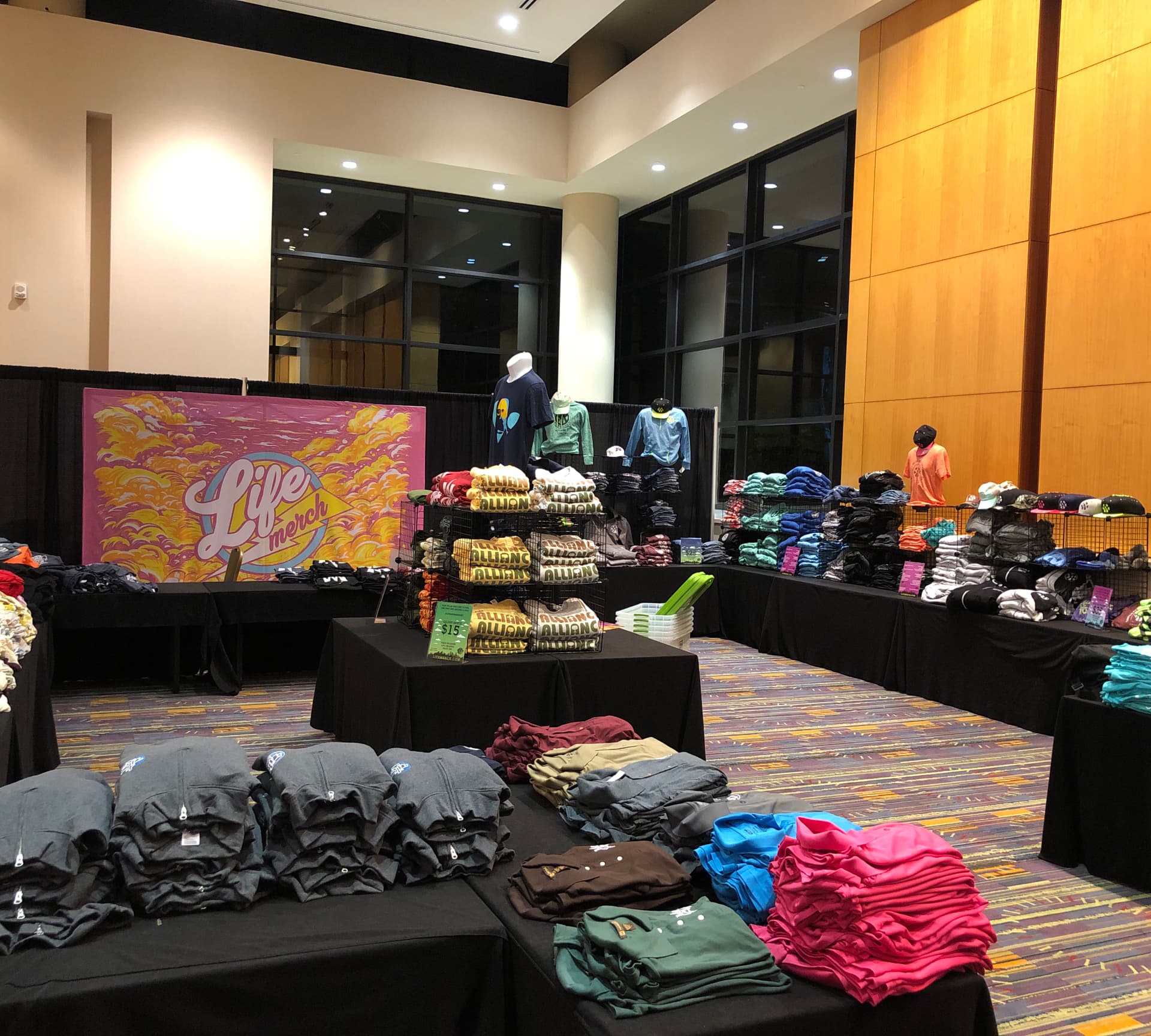 Pop-up apparel store with folded custom printed merch tables by Hardiewear