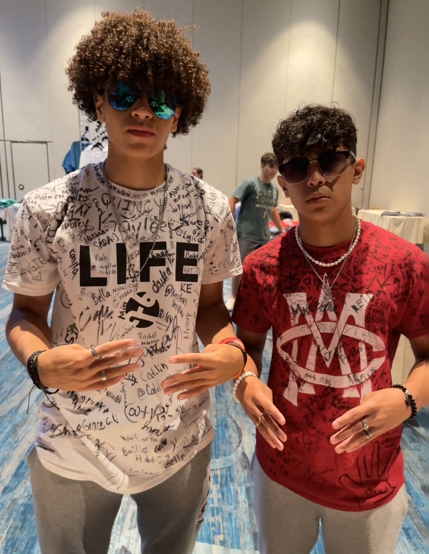 Two teens wearing custom printed event t-shirts by Hardiewear