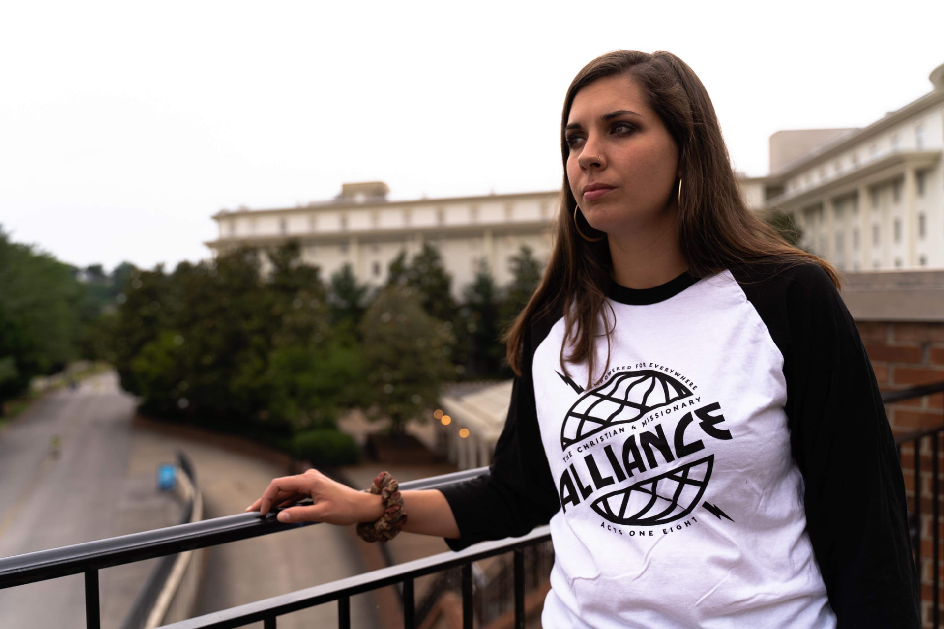 Woman wearing a custom printed raglan baseball tee outdoors by Hardiewear