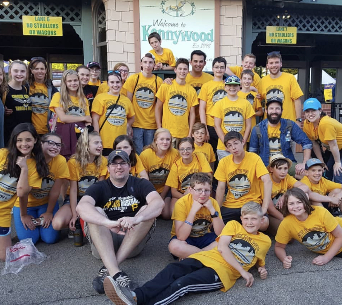 Group in yellow custom printed mission trip t-shirts by Hardiewear