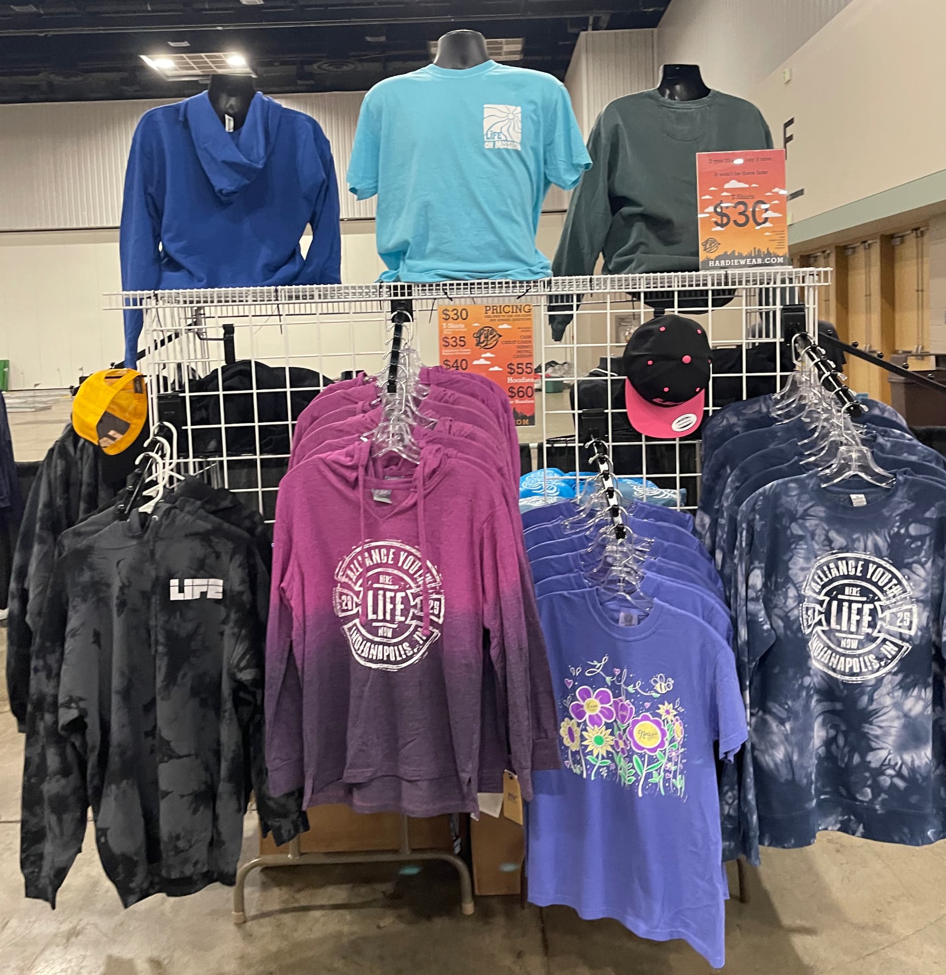 Retail grid display of custom printed hoodies, tees and hats by Hardiewear