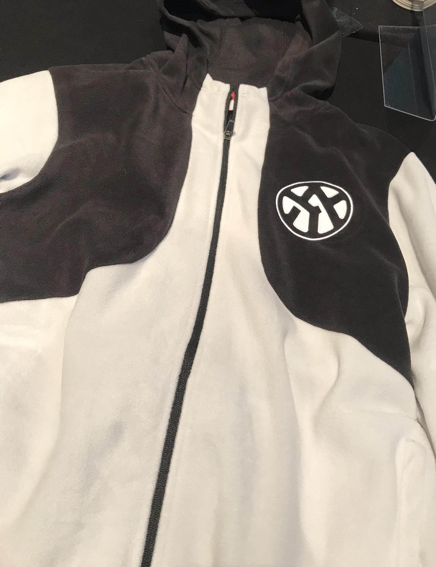 Black and white fleece jacket with custom embroidery by Hardiewear